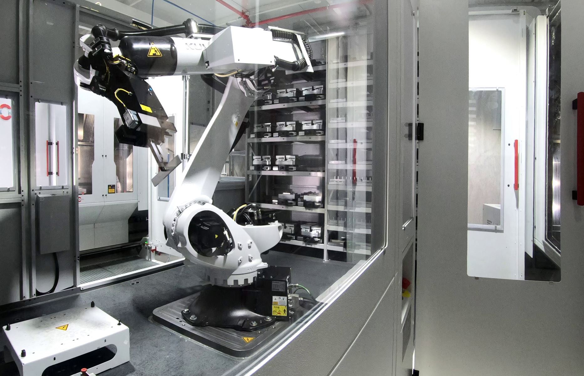 Robot arm and pallet storage inside automation cell