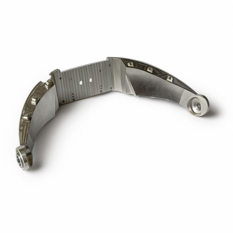 Curved machined support arm with bushed mounting ends
